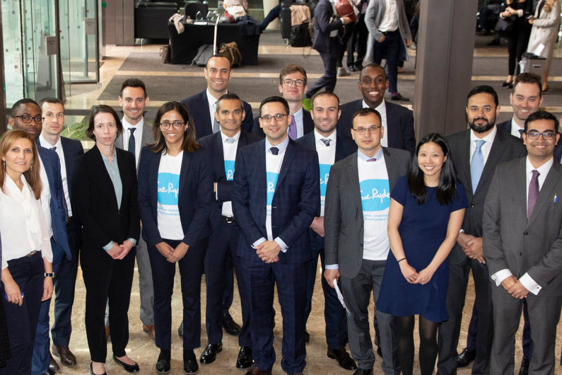 A group of Morgan Stanley employees posing for a photo