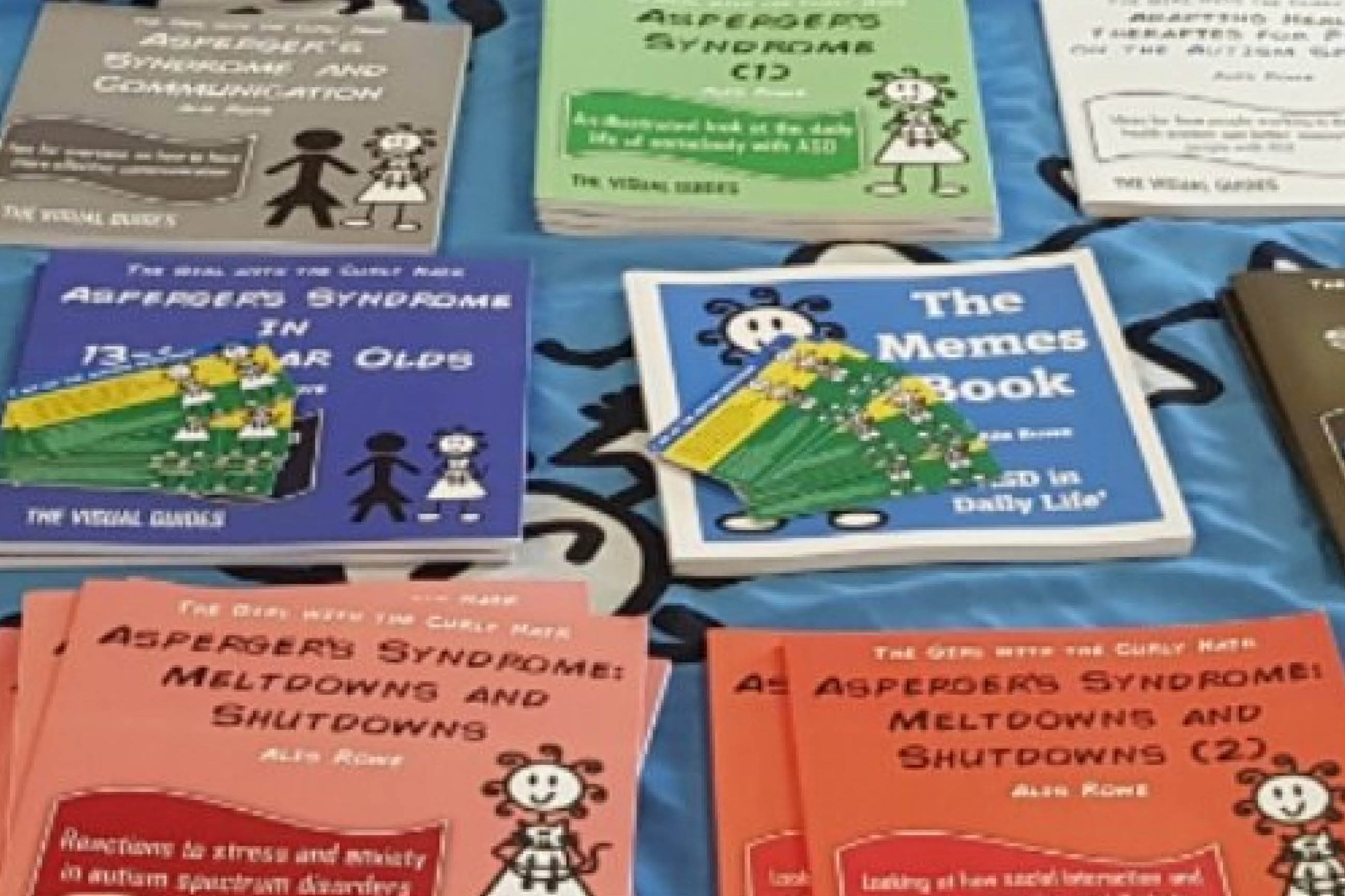 A selection of publications published by The Curly Hair Project on a table