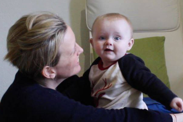 A woman holding a baby