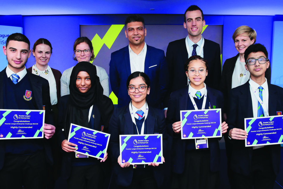 A group of children holding up certificates
