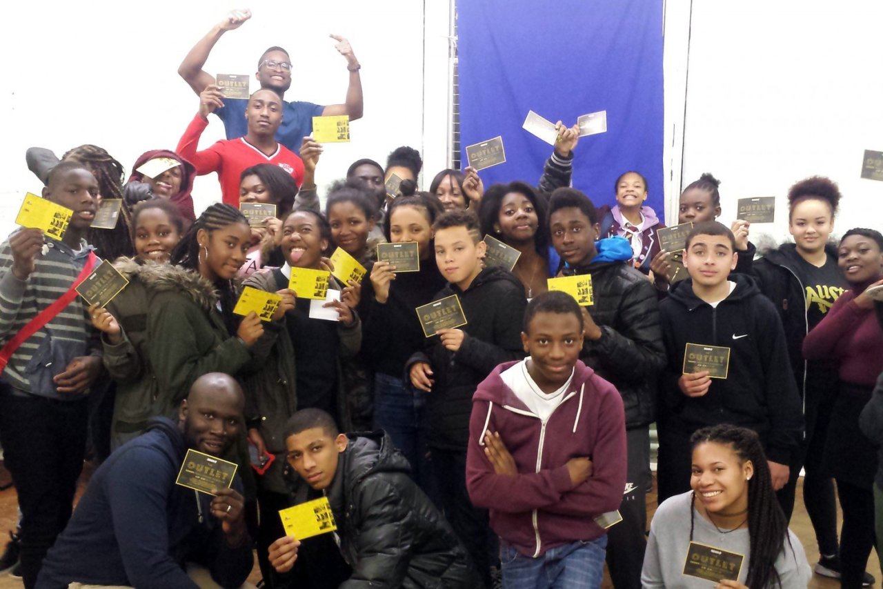 A group of young black people holding certificates