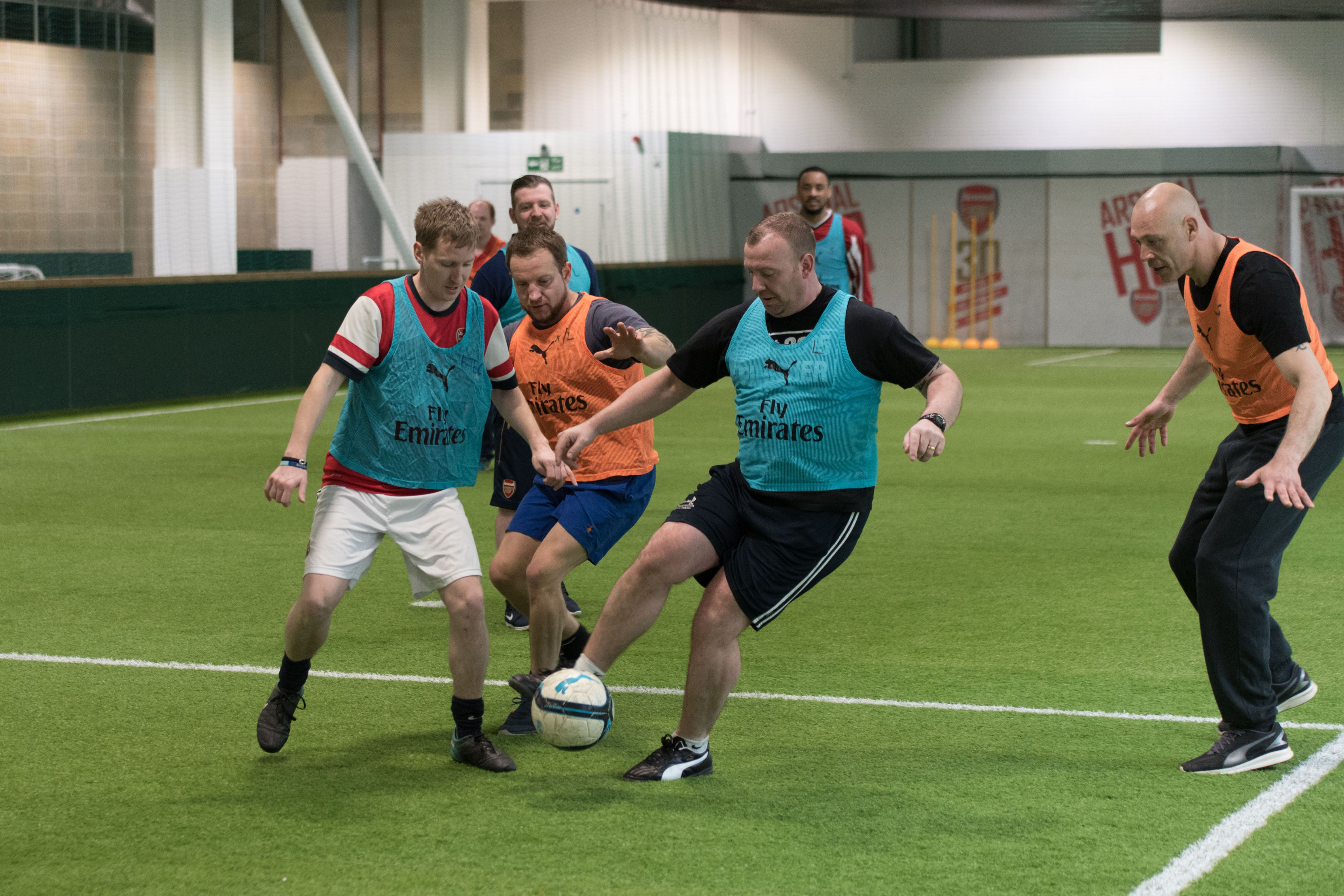 Four men playing football