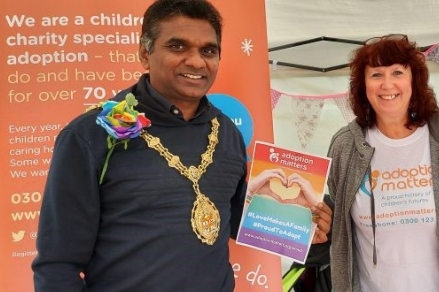Two people at an adoption information fair