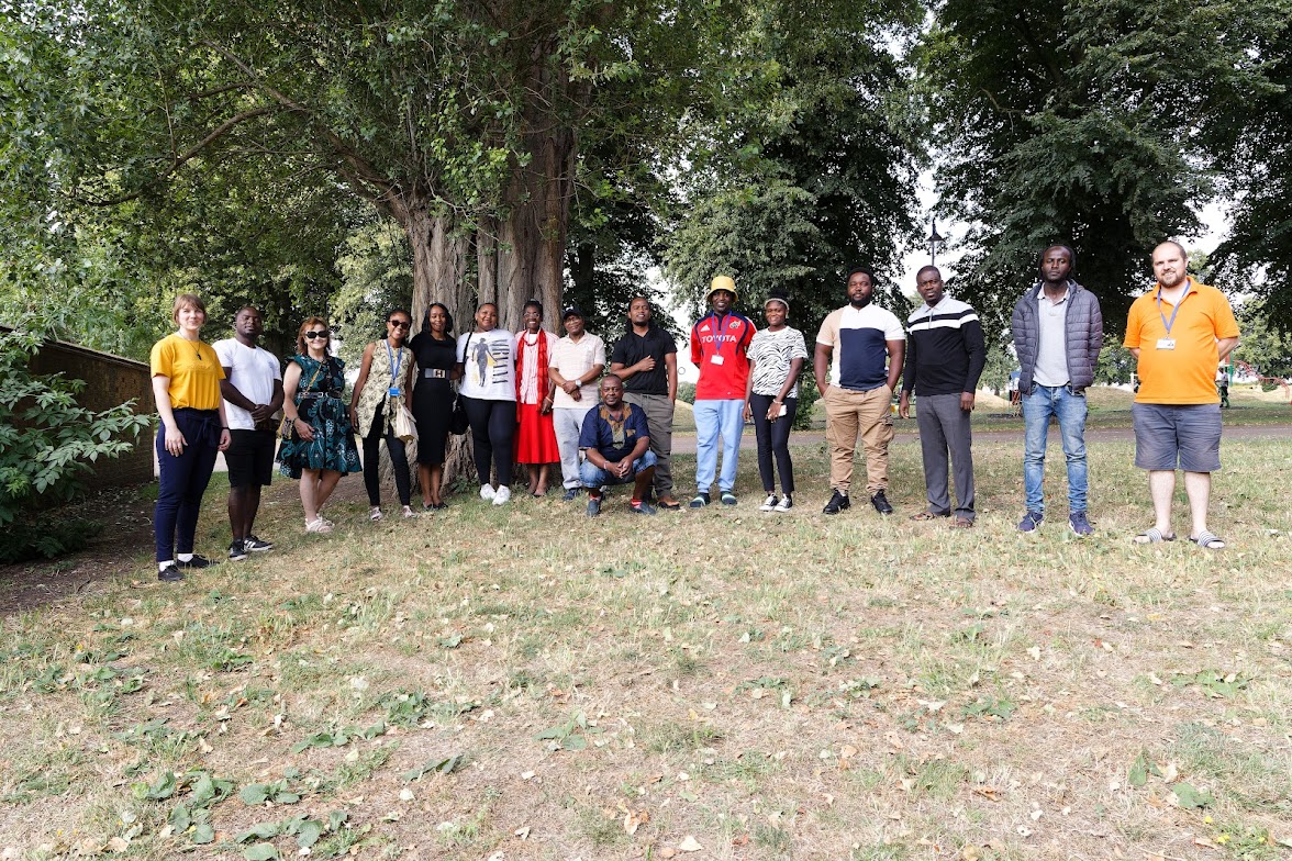Pilotlight Partner Charity UAA_A group of people posing for the camera in a forest