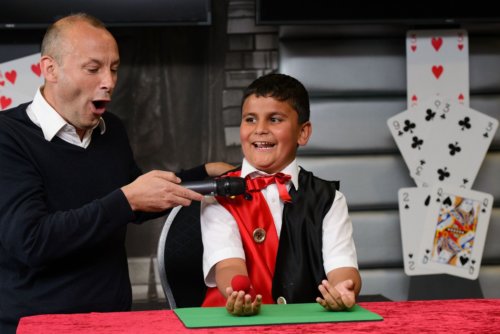 A child performing magic
